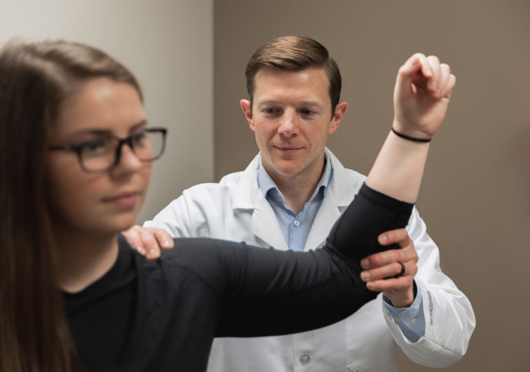 Dr McCabe and patient shoulder exam